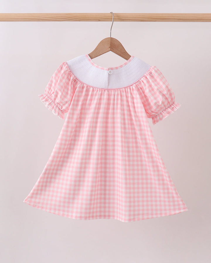 Pink gingham smocked baby dress with short flutter sleeves