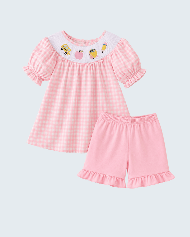 Pink gingham smocked ruffle dress and shorts set with graphic neckline