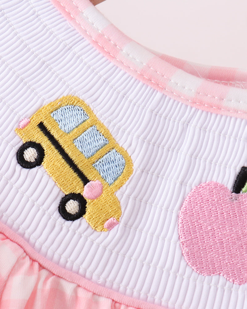 White smocked top with embroidered yellow bus patch and pink ruffled collar