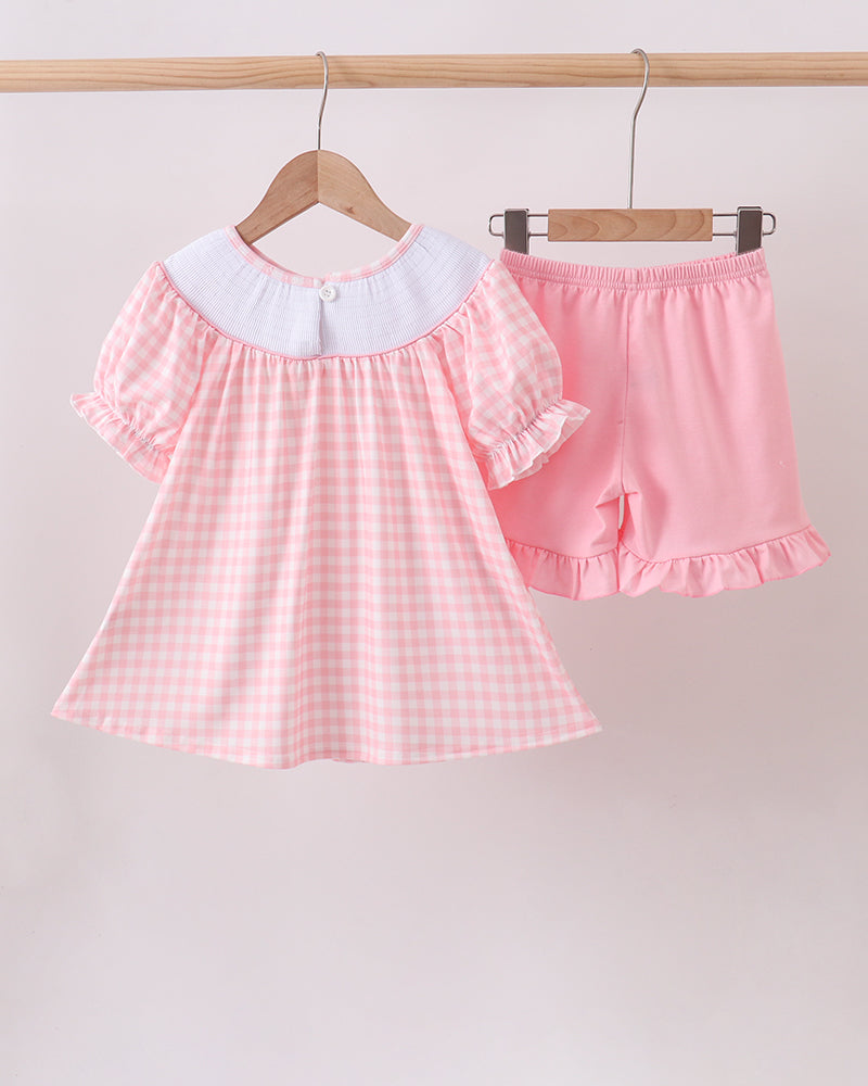Girls pink check ruffle dress and matching pink skirt, smocked neckline and hem