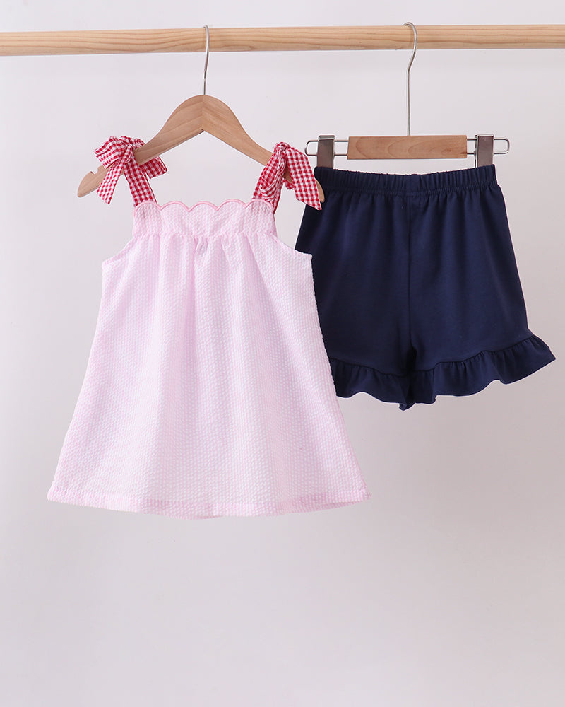 Pink Apple Gingham Shorts Set on wooden hanger