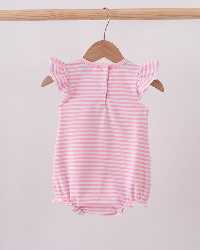 A pink and white striped baby romper with ruffle sleeves, hanging on a wooden hanger from a light wood clothing rack against a plain light background.