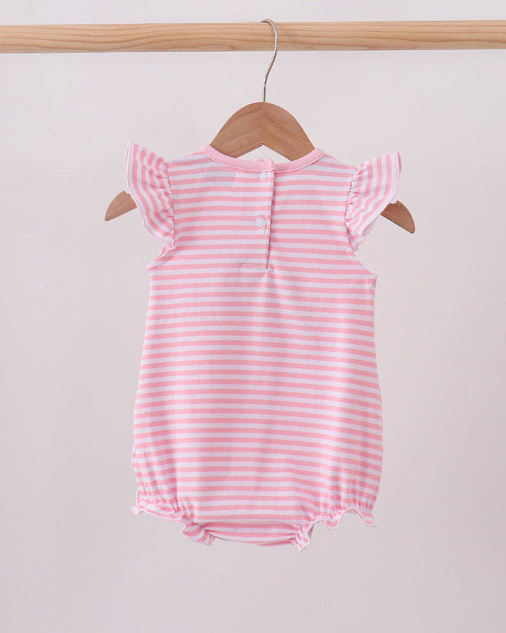A pink and white striped baby romper with ruffle sleeves, hanging on a wooden hanger from a light wood clothing rack against a plain light background.