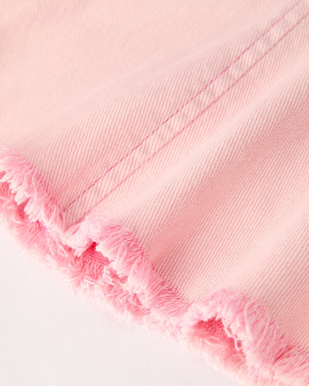 Light pink flare hem with frayed edge and layered ruffle look