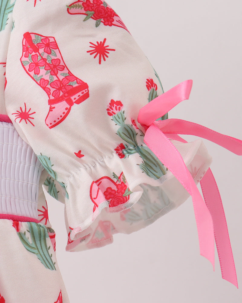 Scarf with pink ribbons and floral designs on a light background