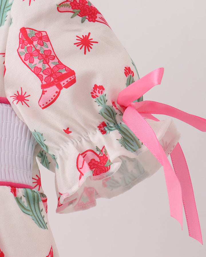 Scarf with pink ribbons and floral designs on a light background
