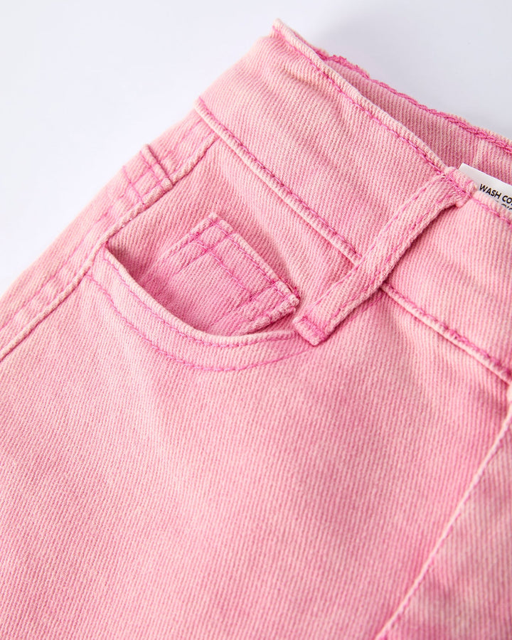 Pink denim pants close-up of waistband and stitched pocket seams