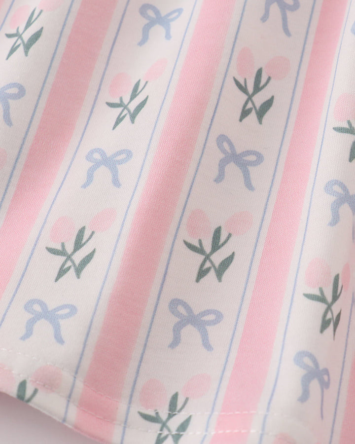 Fabric with pink stripes and blue bow pattern on a light background