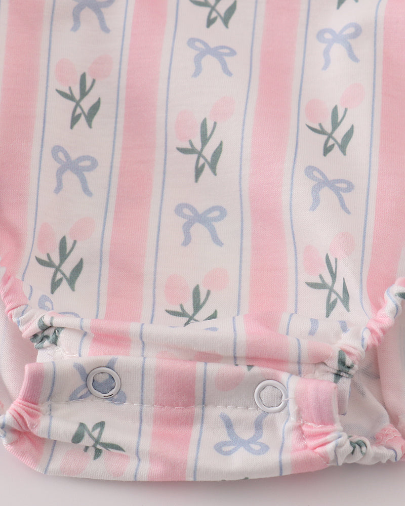 Baby romper with pink and white striped pattern on a light gray background