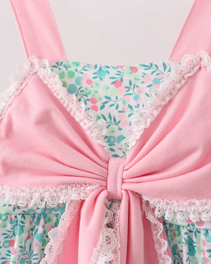 Pink lace-trimmed top with floral pattern on a white background