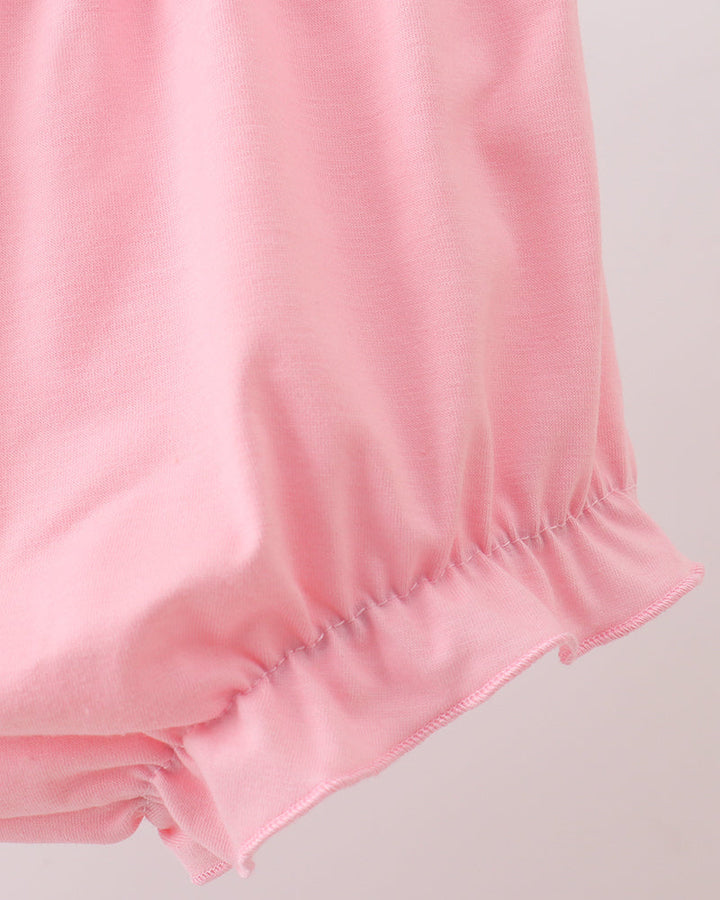 Close-up of pink fabric with a light background