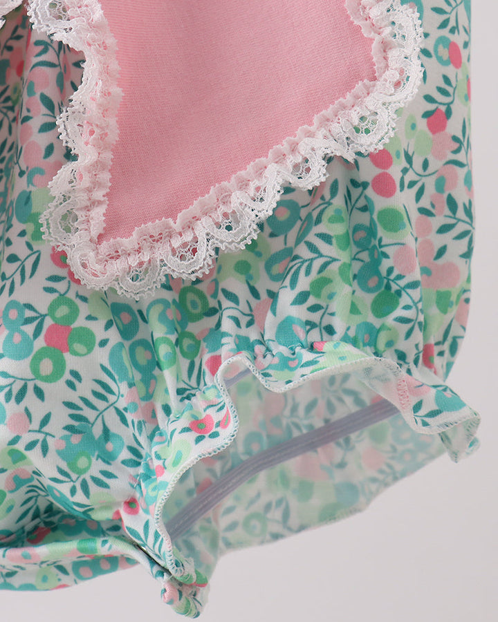 Floral patterned garment with lace trim on a white background
