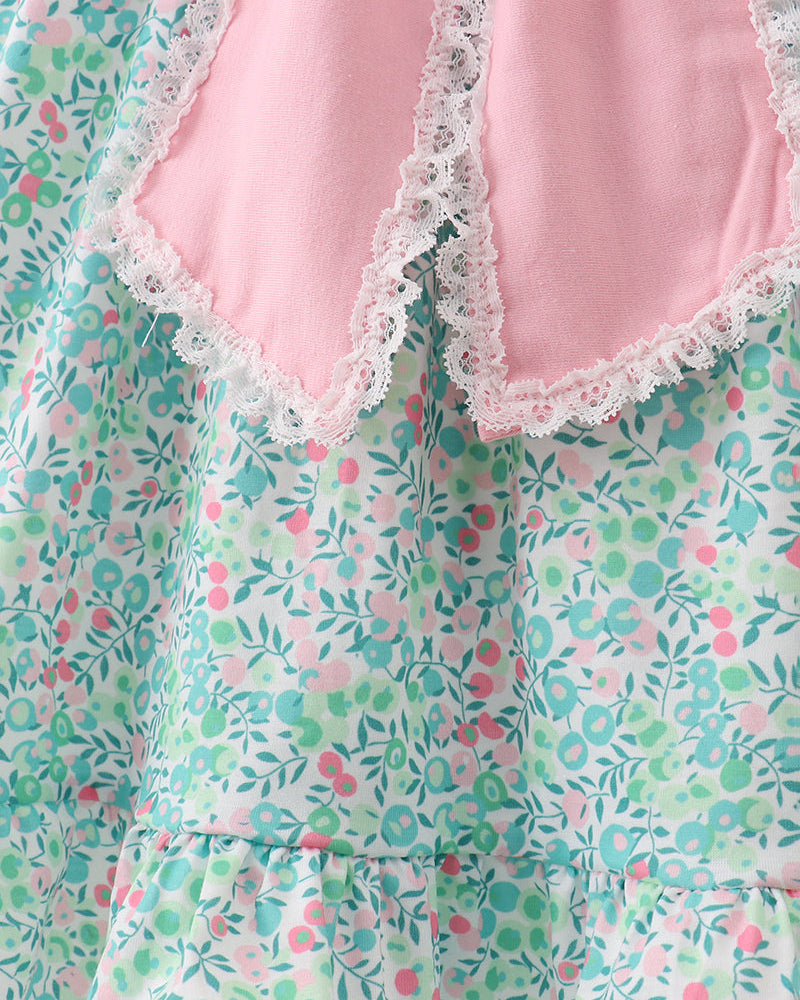 Floral-patterned dress with pink lace trim on a white background