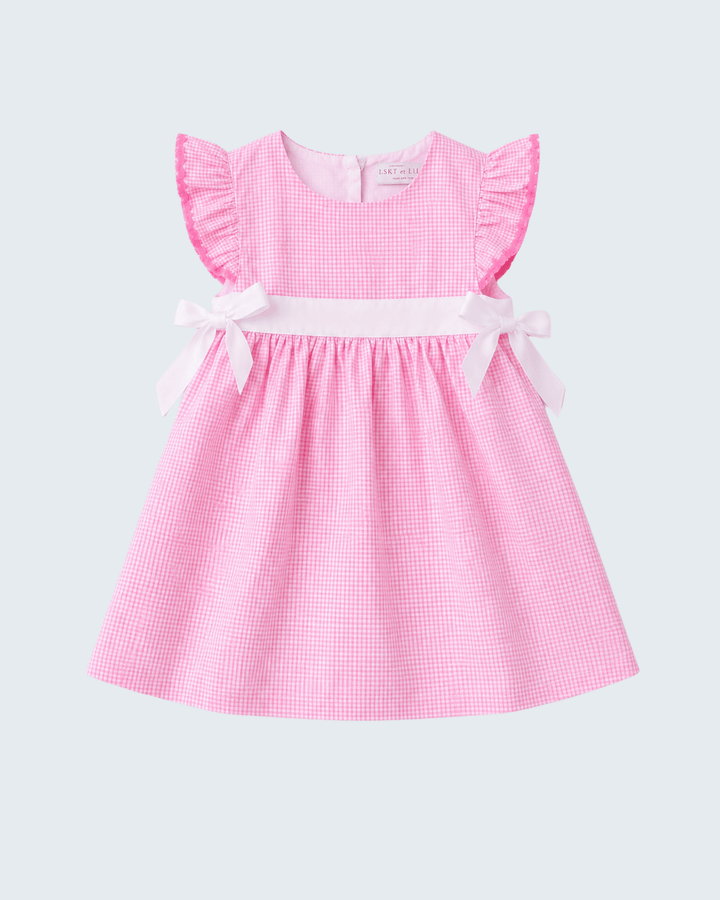 Pink checkered dress with ruffled sleeves on a light gray background