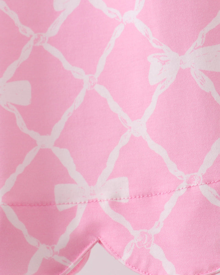 Close-up of pink fabric with white geometric pattern