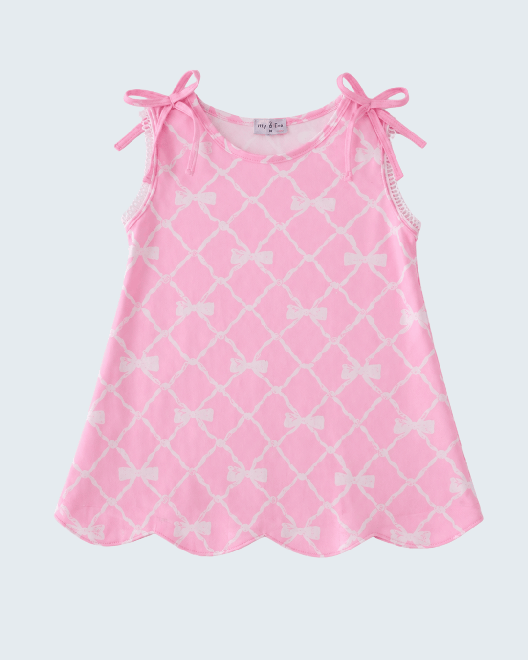 Pink dress with white bow pattern on a white background