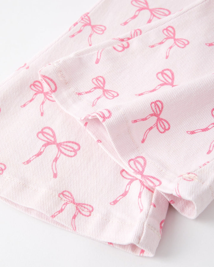 Girls flared jeans with pink bow print, cuff and hem detail