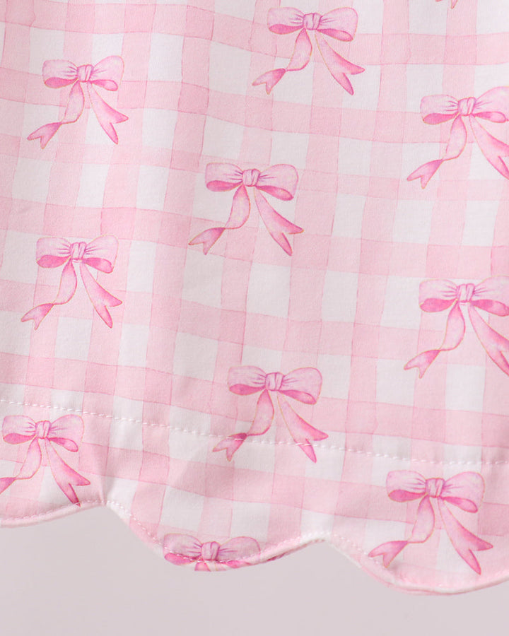 Pink ribbons on a white checkered fabric