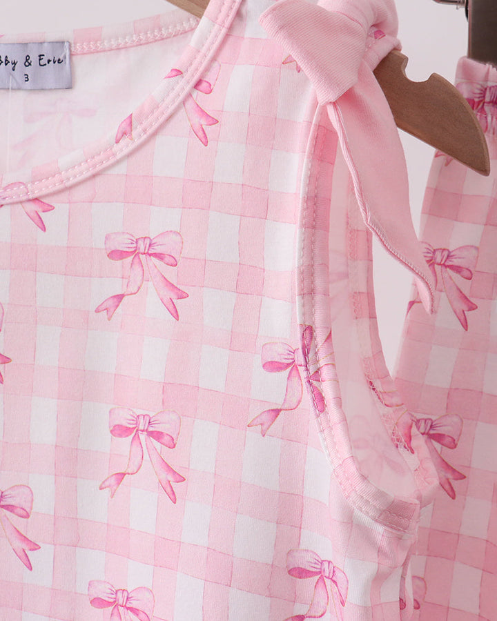 Pink ribbon top on wooden hanger