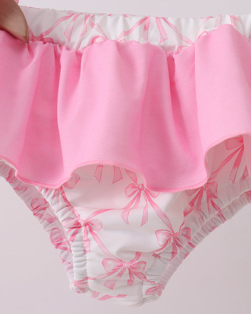 Pink and white patterned garment with a focus on the waistband.
