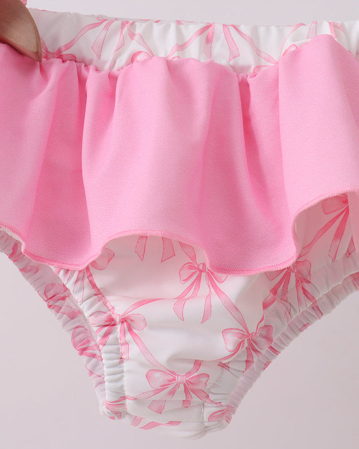 Pink and white patterned garment with a focus on the waistband.