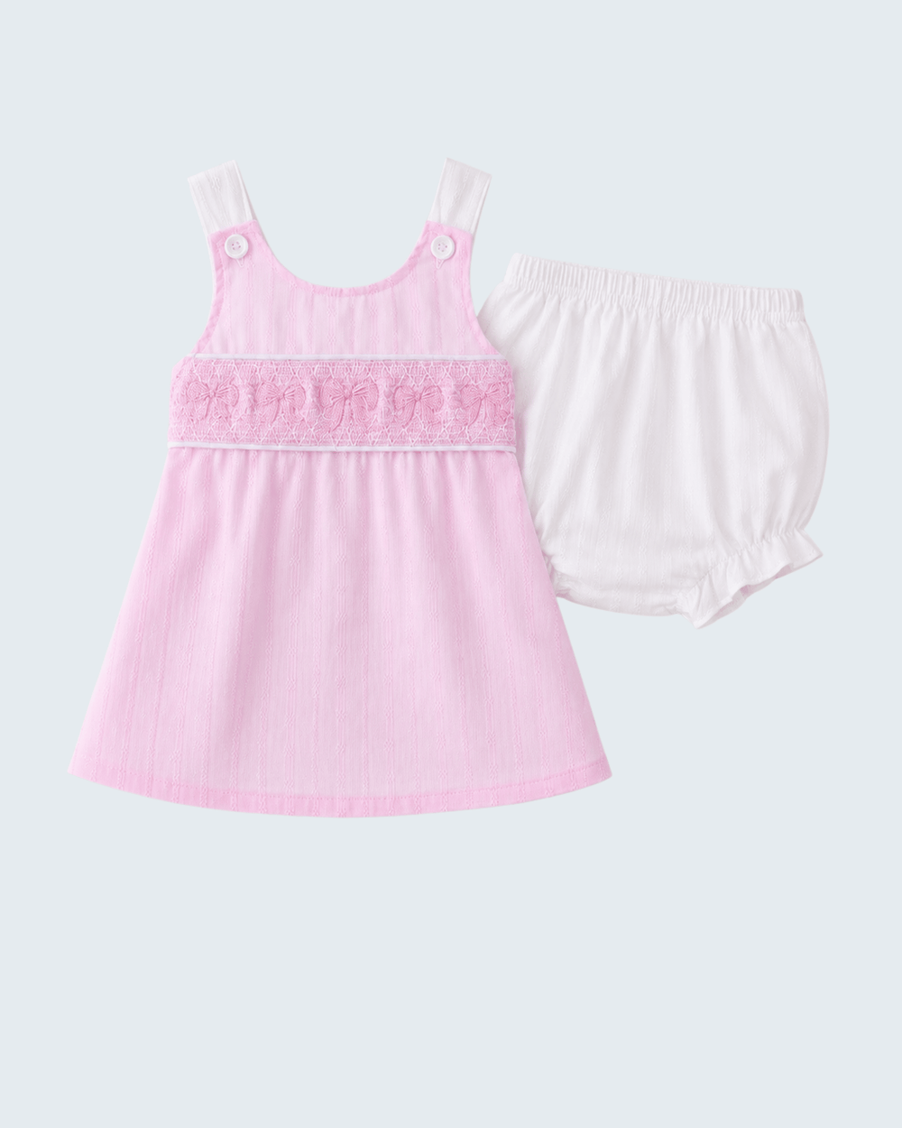 Pink tank top and white shorts set on a light gray background