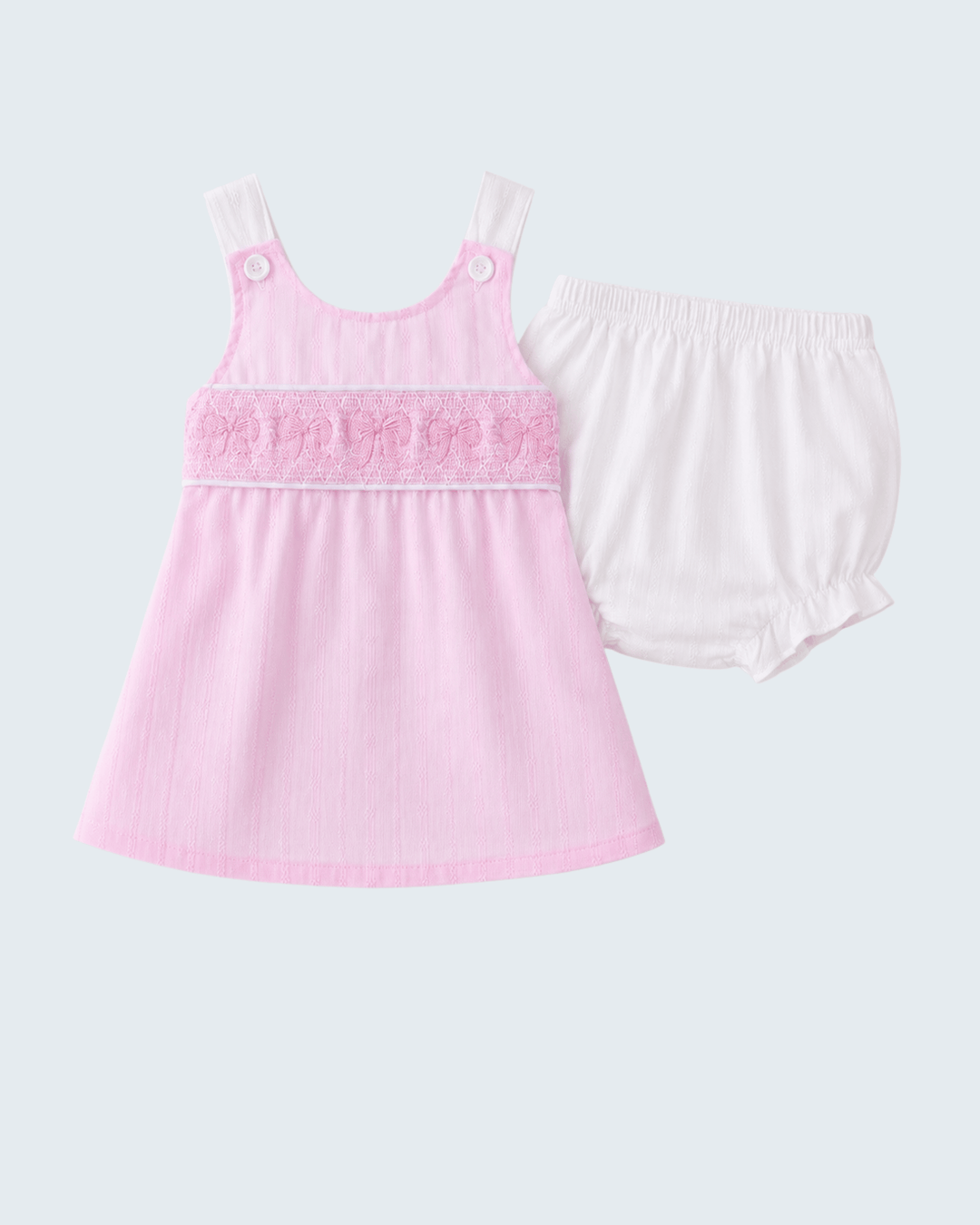 Pink tank top and white shorts set on a light gray background