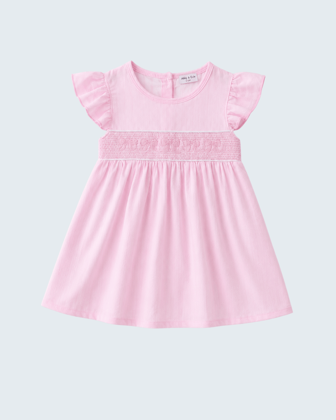Pink dress with ruffled sleeves on a light gray background