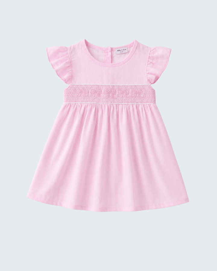 Pink dress with ruffled sleeves on a light gray background