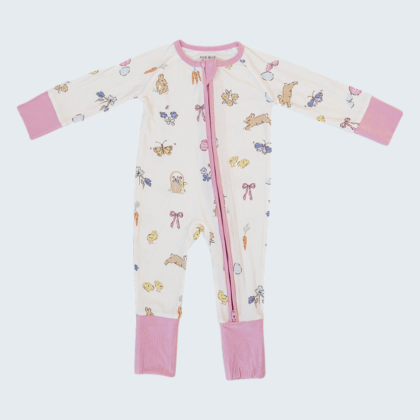 Baby onesie with pink cuffs and hem on a light gray background