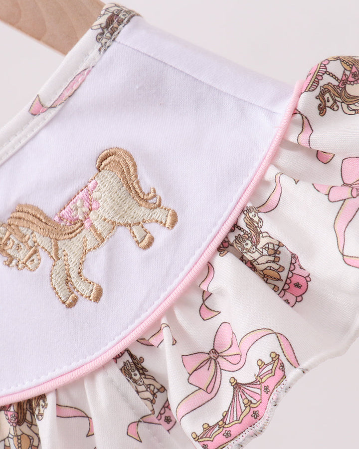 Dress with embroidered horse design on a white background