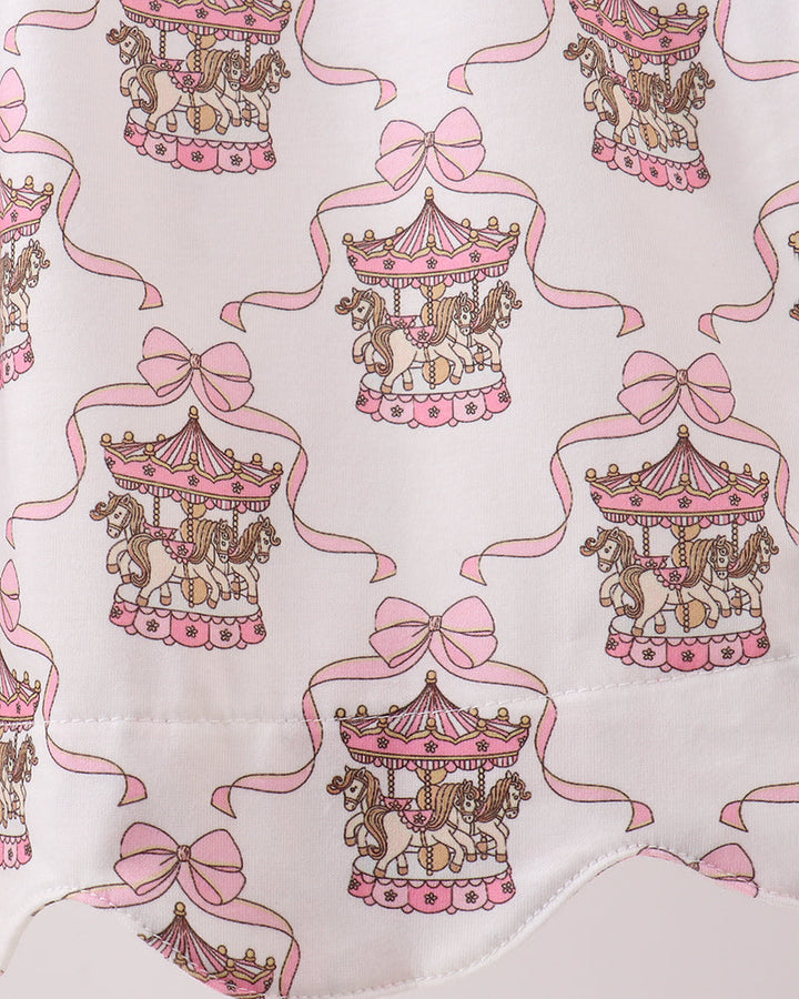 Fabric with carousel and bow pattern on a white background