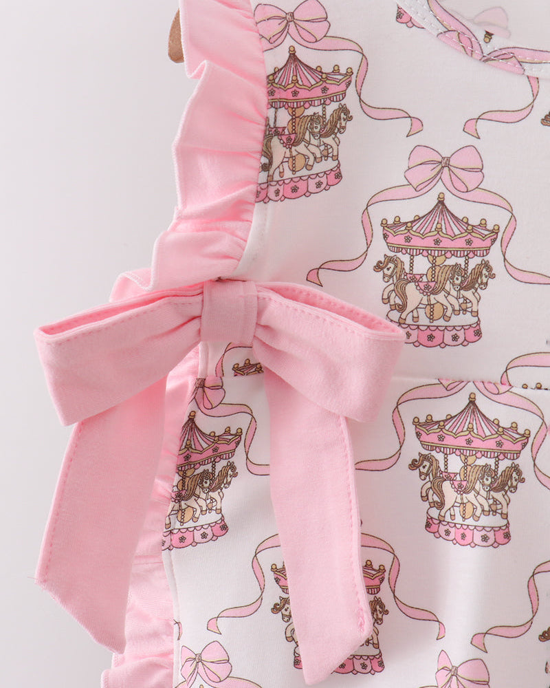 Fabric with carousel and bow pattern on a white background