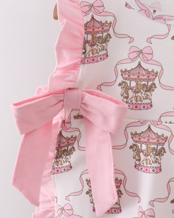 Fabric with carousel and bow pattern on a white background
