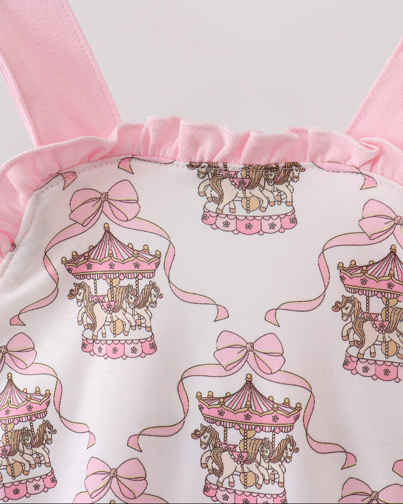 Baby romper with carousel and bow pattern on a hanger