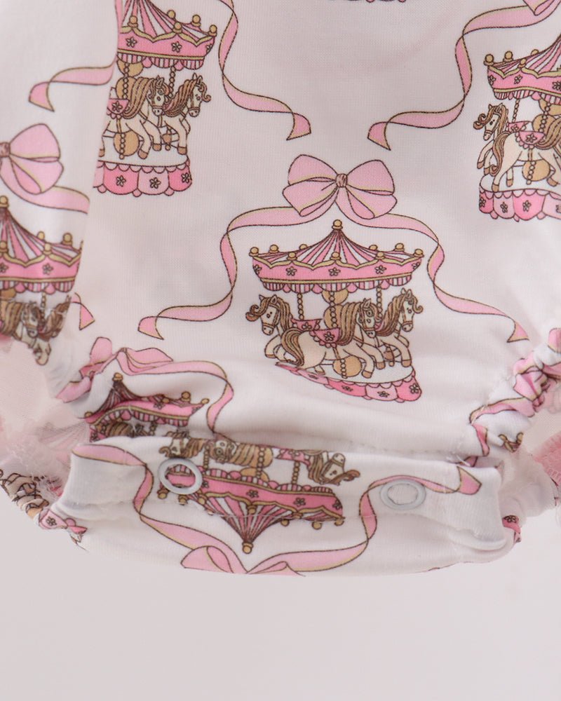 Baby bubble with carousel and bow design on a light pink background