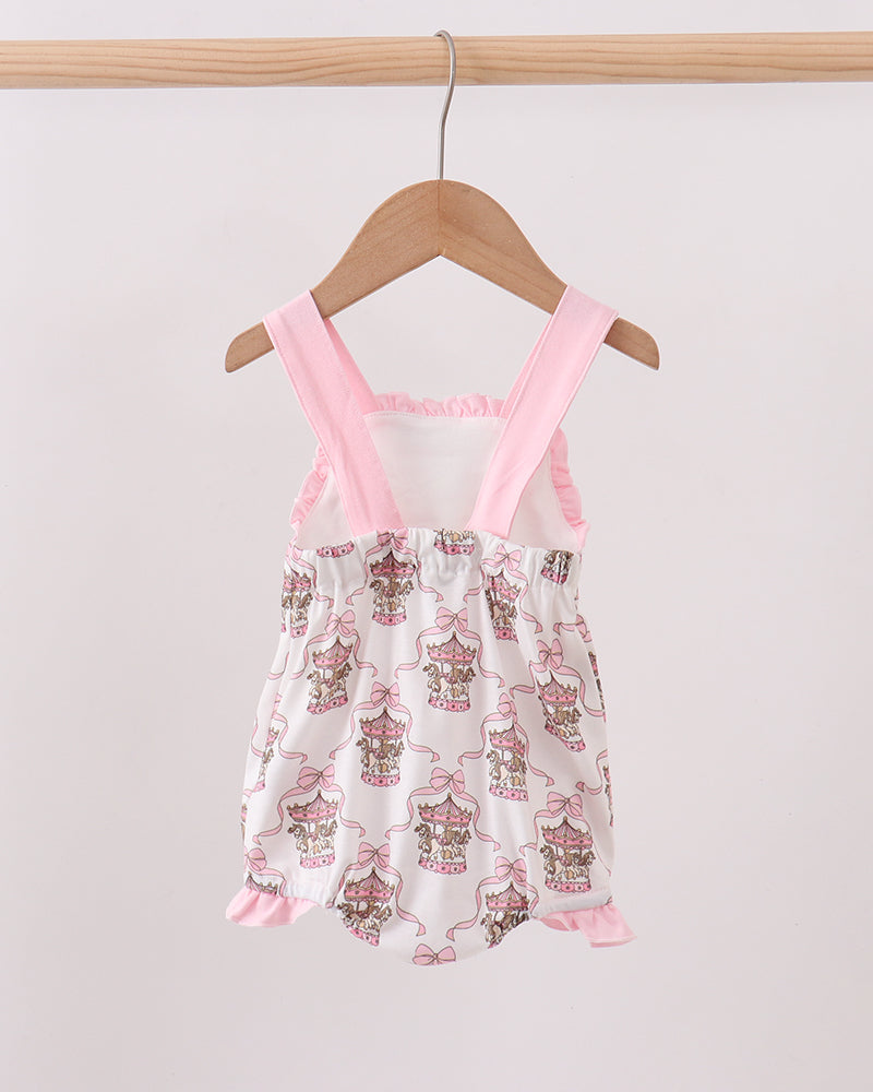 Baby romper with pink straps on a hanger against a white background