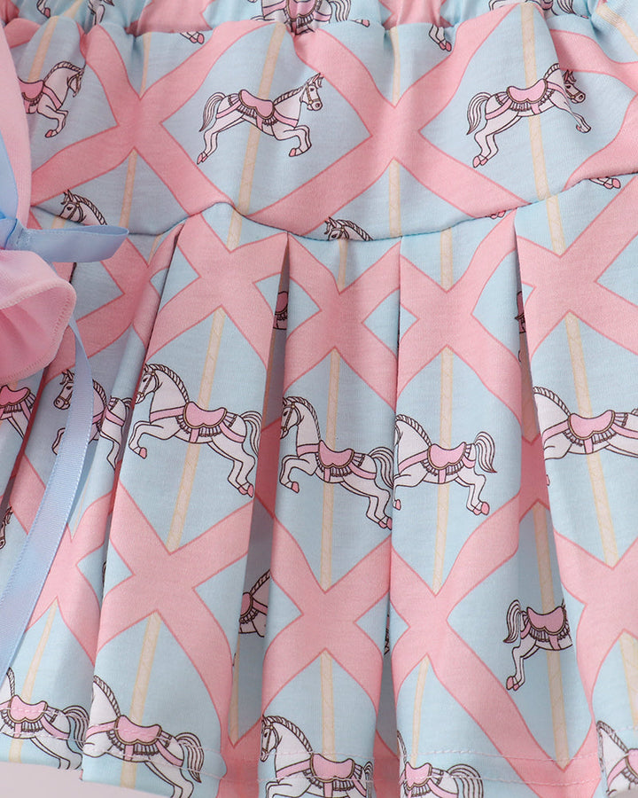 Fabric with pink and blue pattern featuring horses and Xs on a light gray background