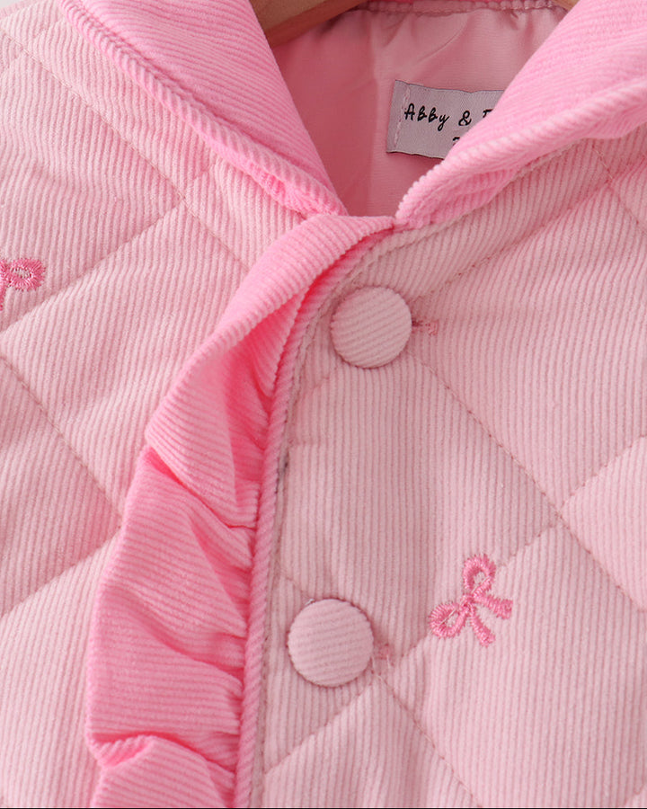 Pink quilted jacket close-up with hood, button placket, and bow embroidery