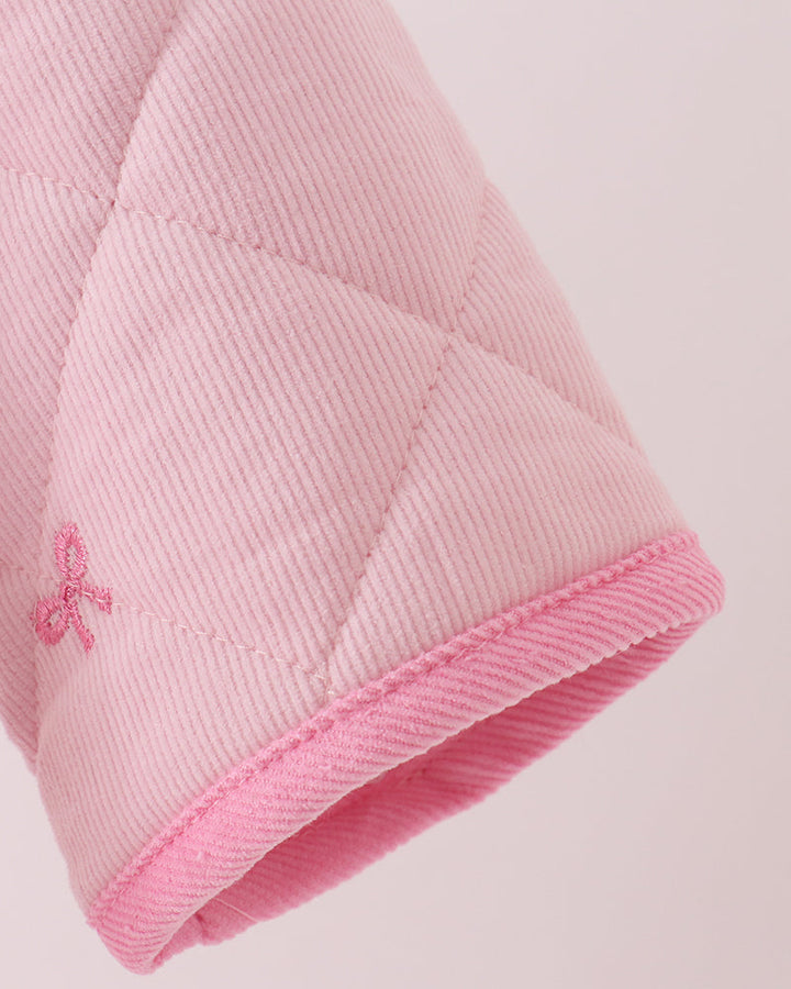 Pink quilted jacket sleeve with ribbed cuff and bow embroidery