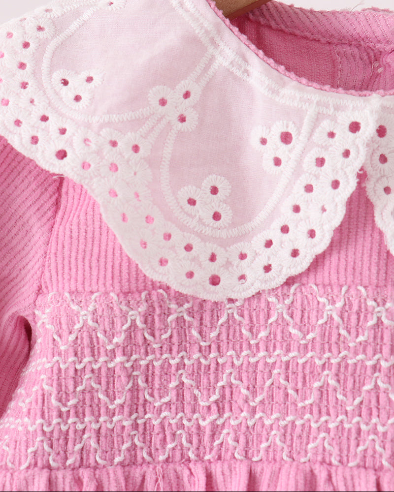 Pink corduroy bubble romper with scalloped lace bib collar