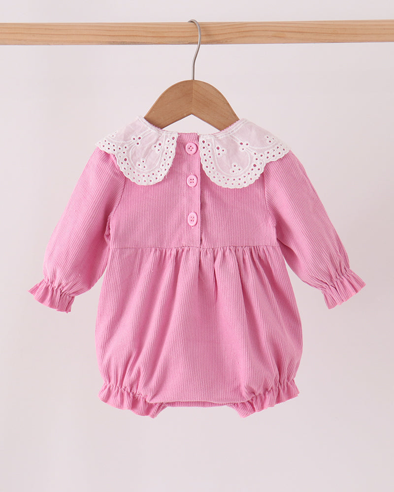 Pink corduroy bubble romper with scalloped lace collar and button front