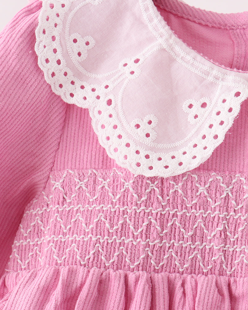 Pink corduroy dress with white lace peter pan collar and smocked bodice