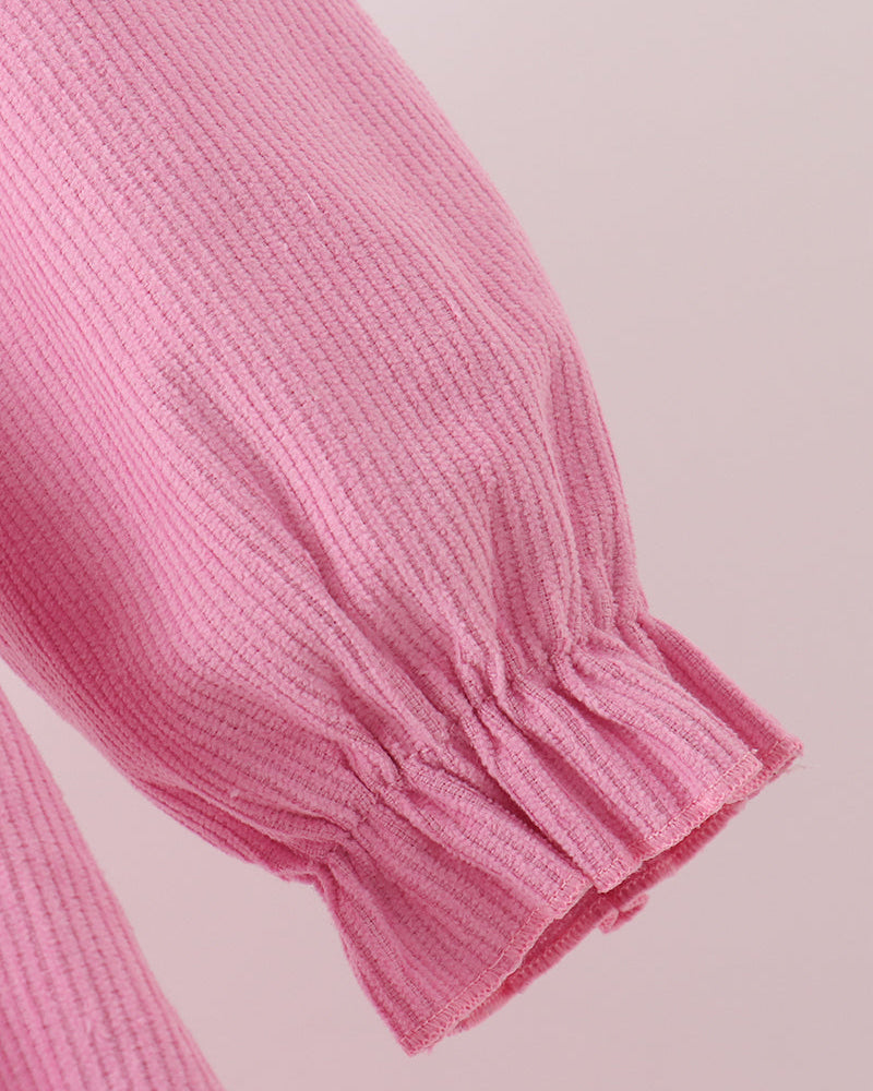 Pink corduroy dress sleeve with gathered ruffle cuff