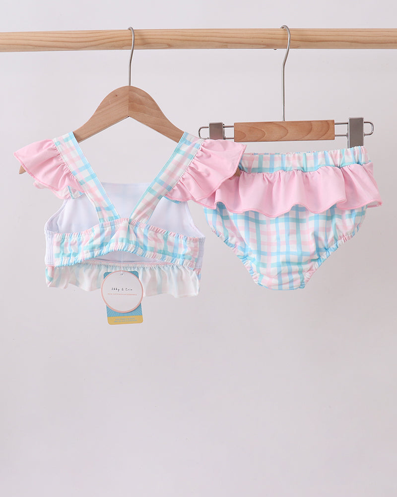 2-piece gingham swimsuit set on hangers with ruffled top and matching ruffle-trim bottoms