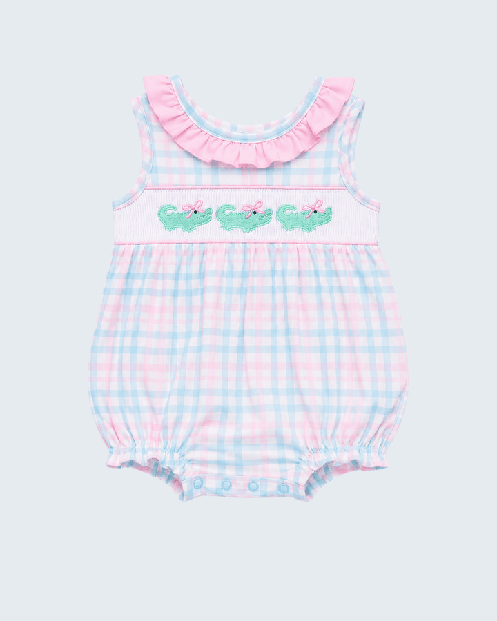 Pink-and-blue gingham baby bubble romper with green crocodile applique and pink bow ruffle