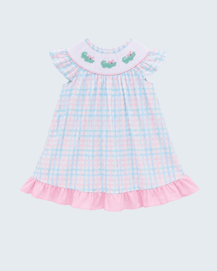 Sleeveless gingham dress with flutter collar, alligator appliques, and pink ruffle hem.