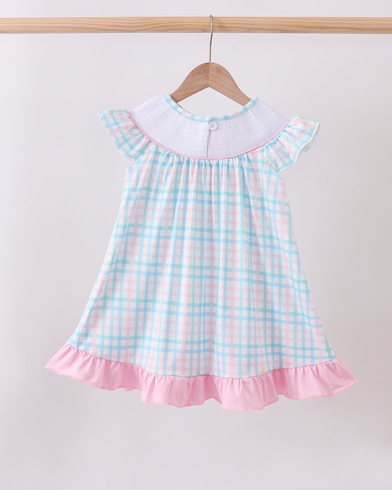 Pink-and-blue gingham smocked dress with flutter sleeves and pink ruffle hem.