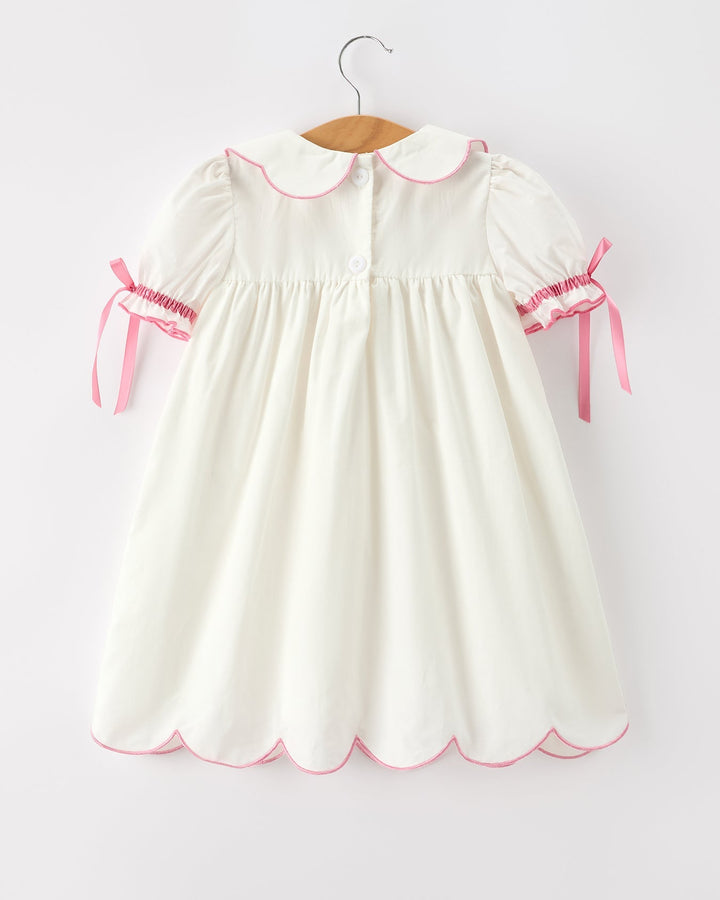 Girls cream christening dress with pink-trim Peter Pan collar and bow cuffs