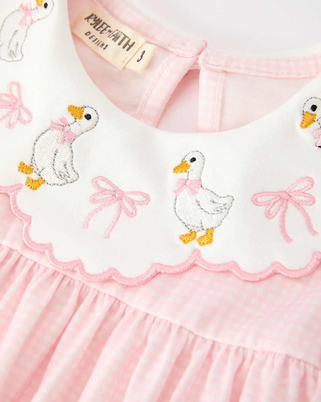Pink embroidered Peter Pan collar with ducks and bows, scalloped edging